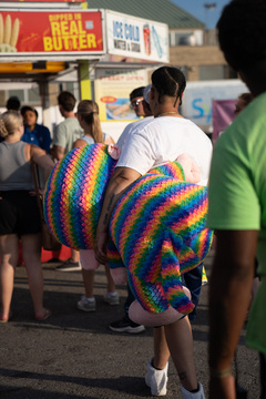 Many fairgoers carried around their carnival prizes as they meandered around the fair, ate food and visited attractions.