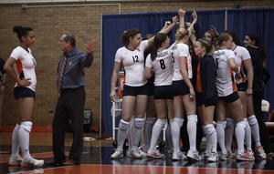 Leonid Yelin talks to Silvi Uattara during Syracuse's home opener Wednesday night. The Orange lost to Binghamton in five sets.