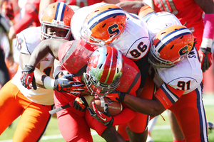 From left: Siriki Diabate, Jay Bromley, Brandon Sharpe and the Orange defense are focused on improving the team's -10 turnover margin.