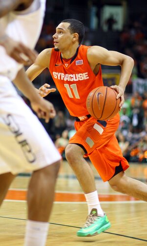 Tyler Ennis surges to the bucket in No. 2 Syracuse's 64-52 win over Miami (Fla.) on Saturday. Once again, Ennis played hero when the team needed an offensive push late in the game. 