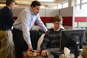 Jeff Rubin works with a member of his staff. He said his 