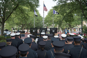 Syracuse first responders look on during a ceremony held downtown Sunday in remembrance of the Sept. 11 attacks. Jeff Kozuch, the father of SU student Kate Kozuch, was a first responder in New York City on Sept. 11. 