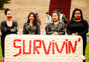 Students held a silent protest on sexual assault issues on Syracuse University's Quad on Oct. 4, 2016. President Donald Trump has been criticized for his past recorded comments saying it's okay to grab women 