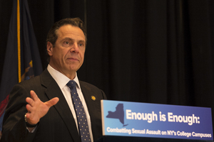 Gov. Andrew Cuomo signed legislation on Monday raising the age of criminal responsibility to 18 years old.