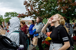 Freshman music industry major Erin Manion chants 