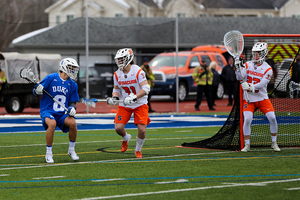 Jacob Buttermore patrols the crease in front of Syracuse goalkeeper Drake Porter in last week's win over then-No. 2 Duke.