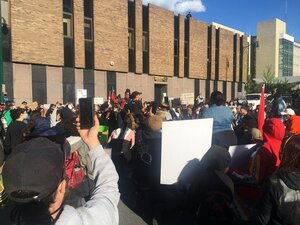 Protesters rally outside the Onondaga County Sheriff's Office building.