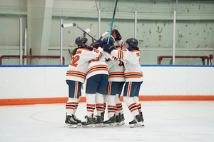 Syracuse ice hockey celebrates a goal at Tennity Ice Arena.