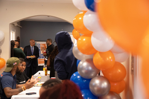 Students, faculty and staff gather in 119 Euclid on Wednesday to celebrate the building's one year anniversary. Attendees shmoozed over fish fry and cake while a DJ played music that emanated through the space.