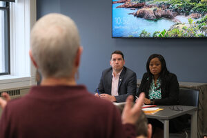 Mayor Ben Walsh and City Clerk Patricia Katie McBride listen to a community member’s concerns about an amendment which alters leadership selection procedures. Several community members called on Walsh to veto the amendment.