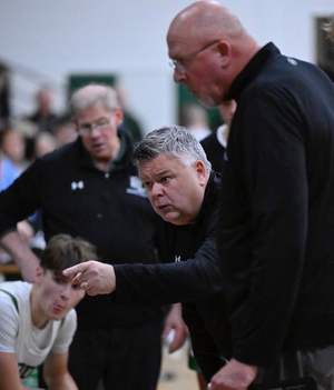 Gallagher Driscoll (middle) helped Bishop Ludden to three sectional championships as a player from 1985-88. Now he's seeing success as its head coach.