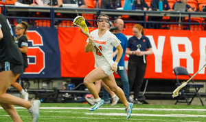 No. 6 Syracuse squandered a two-goal fourth quarter lead and fell to No. 7 Johns Hopkins 14-13 in overtime Monday. 