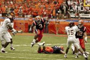 Delone Carter hurdles through the air Saturday during Syracuse's overtime loss to Minnesota. The tailback finished with 88 yards on 23 carries and was an integral component in the Orange's 'Stallion' formation, a variation on the 'Wildcat' formation.