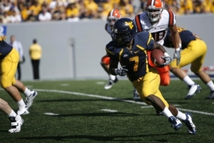 West Virginia running back Noel Devine busts loose for a back-breaking touchdown against Syracuse on Saturday. 