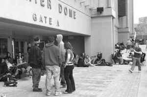 Students wait outside the Carrier Dome on Tuesday, hoping to buy tickets for SU&s NCAA game in Albany.