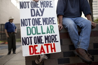 Supporters held up a sign against war.