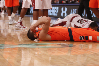 Michael Carter-Williams hides his face from the Madison Square Garden crowd of 12,648.