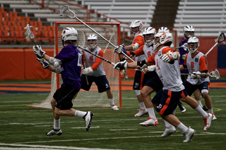 Syracuse goalkeeper Bobby Wardwell prepares for a Holy Cross shot.