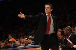 Rick Pitino gestures to the court in the first half against his former boss, Jim Boeheim.