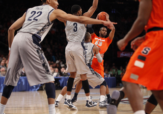 James Southerland looks for an opening as the team drives its way down the court.