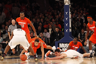 Michael Carter-Williams dives for a ball fumbled by Pittsburgh.