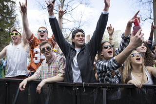 Students cheer as Sound Remedy performs on stage at MayFest, Friday afternoon.