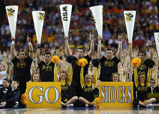 Wichita State cheerleaders watch from the sideline.