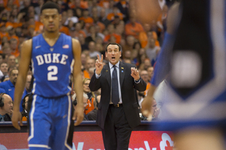 Krzyzewski directs his team during free throws. 