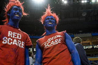 Two Dayton fans pose prior to tipoff.