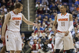 Ennis and backcourt mate Trevor Cooney exchange a high-five. 