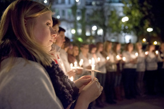 Tonya Bauer, a senior history and broadcast and digital journalism dual major and Remembrance Scholar, and other Remembrance Scholars listen during a portion of the evening when members of the community were encouraged to give their thoughts about those who died on Pan Am Flight 103.