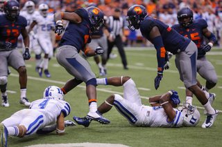 Reddish stands over Jamison Crowder after shoving him to the ground. Eskridge, on the left, comes over to help. 