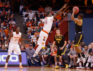 Freshman point guard Kaleb Joseph defends against a Kennesaw State jump shot.