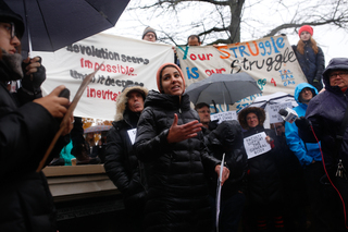 Yanira Rodriguez, one the sit-in organizers, speaks during a solidarity rally on Monday afternoon.