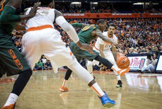 Michael Gbinije looks for Christmas in the post. The big man had 23 points. 