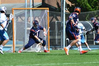 Bobby Wardwell makes one of his three first-half saves. He was pulled at halftime for backup Warren Hill.