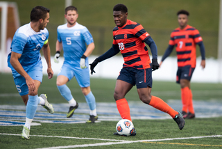 Miller dribbles the ball down the field.