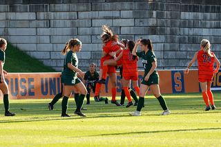 Bennett celebrates with her teammates after scoring the first goal of the night.