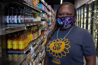 Troysheya McDonald, one of the co-op's head cashiers, is excited to be working at the new location, which is more accessible to public transportation.