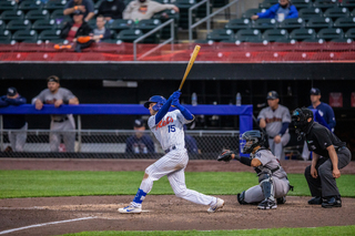 Drew Jackson swings at a pitch during the Mets' opening day game.